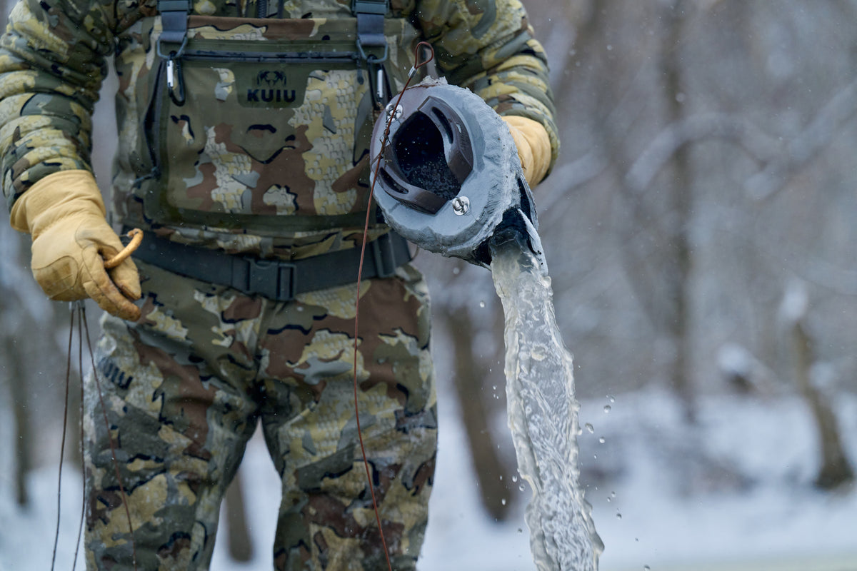 Hunter lifting a HydroFoam decoy out of the water